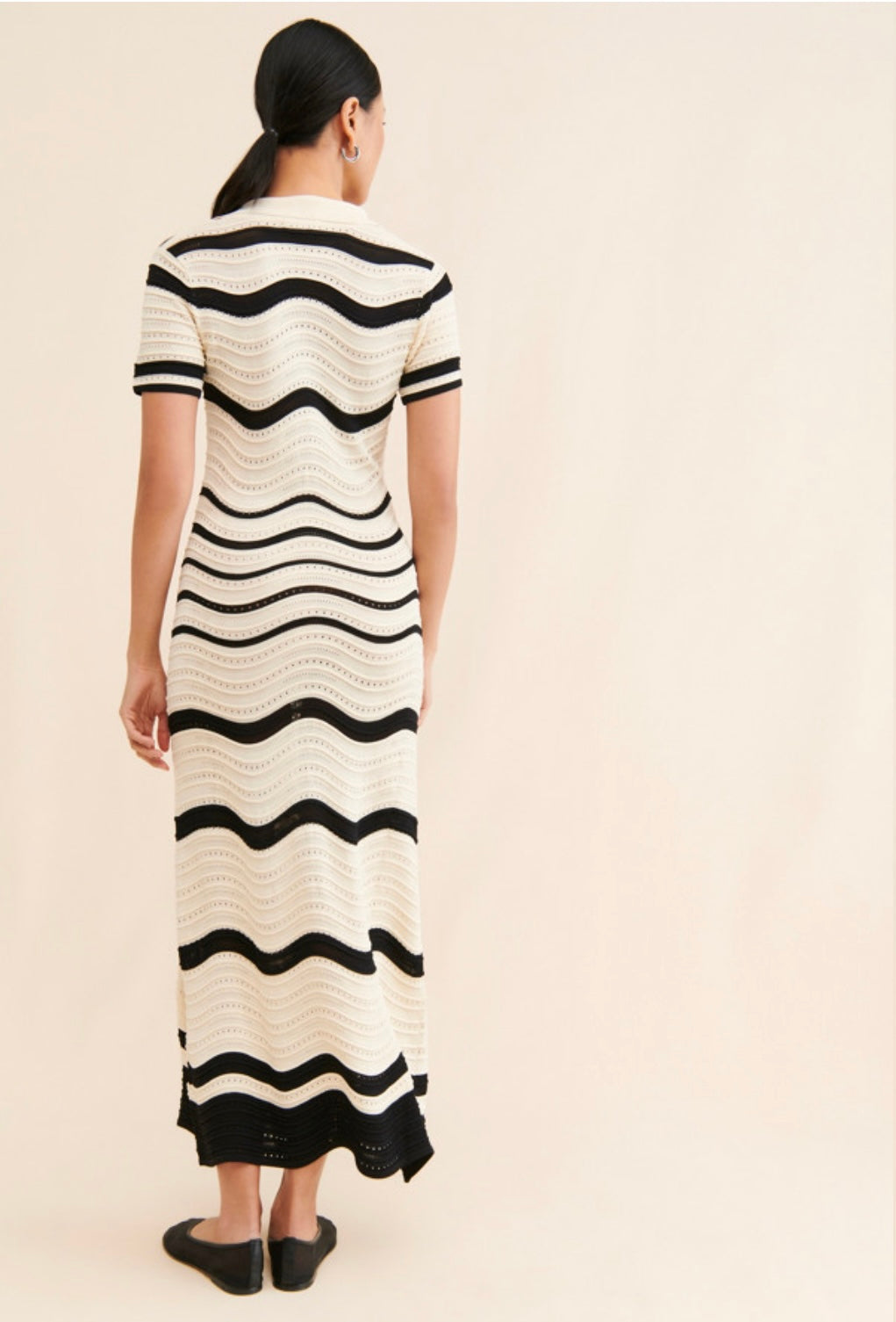 Retro Ripple Dress – bold, fitted, and effortlessly cool.